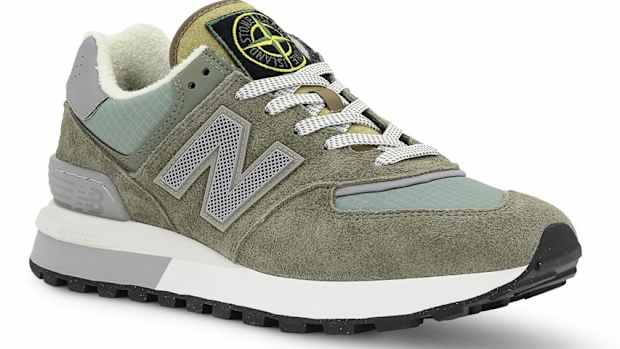 View of grey and white New Balance shoe.